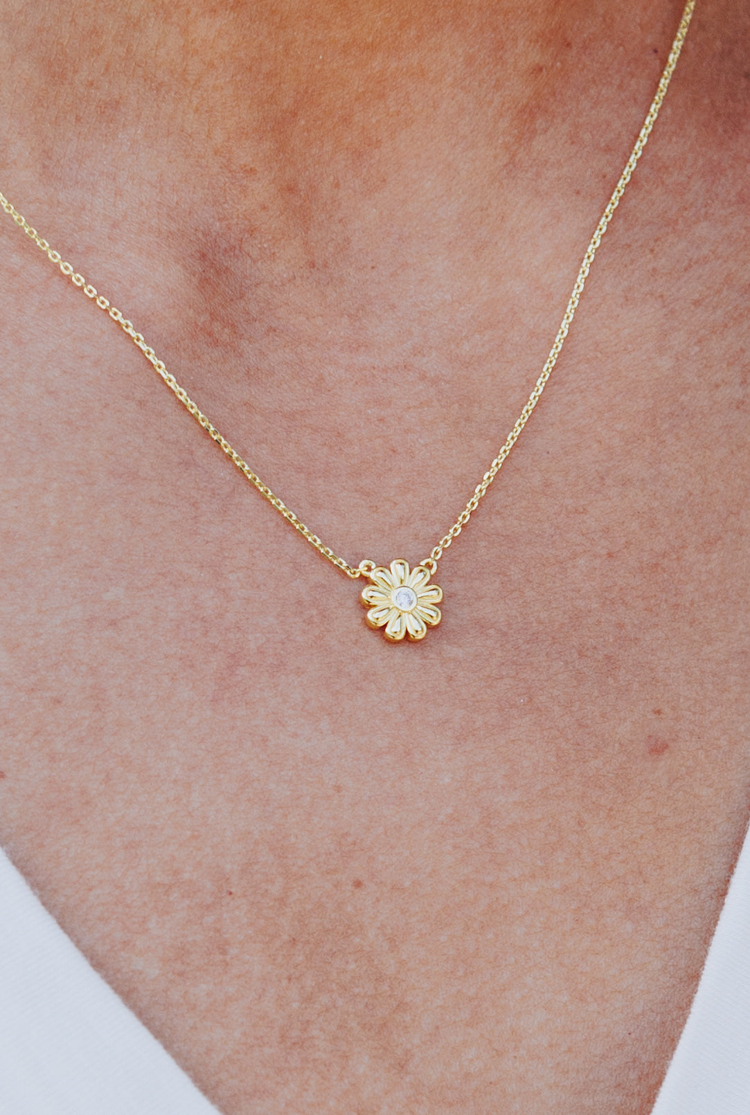 gold nine 9 petal Baha’i inspired flower necklace with zircon diamond